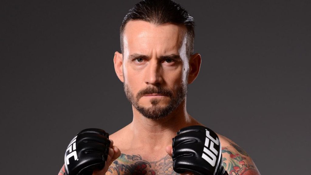 032615-ufc-phil-cm-punk-brooks-poses-for-a-photo-pi-vresize-1200-675-high-29